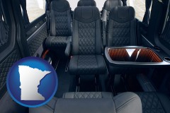 minnesota map icon and black leather seats in a customized van