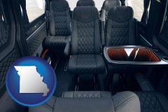missouri map icon and black leather seats in a customized van