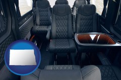 north-dakota map icon and black leather seats in a customized van