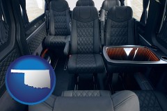 oklahoma map icon and black leather seats in a customized van