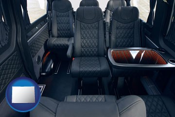 black leather seats in a customized van - with Colorado icon