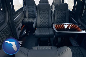 black leather seats in a customized van - with Florida icon