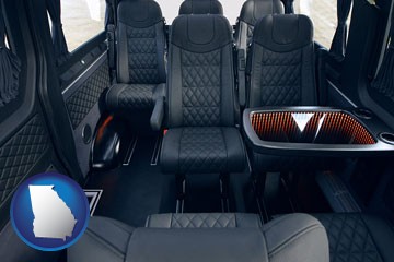 black leather seats in a customized van - with Georgia icon