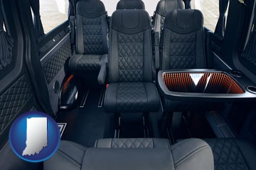 black leather seats in a customized van - with Indiana icon