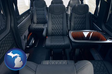 black leather seats in a customized van - with Michigan icon