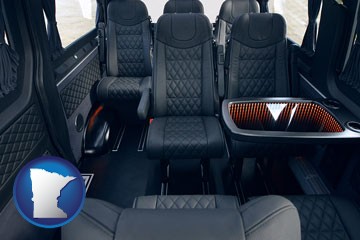 black leather seats in a customized van - with Minnesota icon