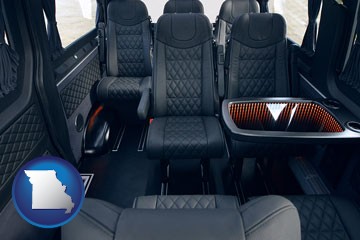 black leather seats in a customized van - with Missouri icon