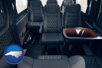black leather seats in a customized van - with North Carolina icon