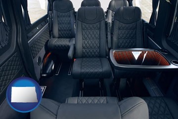 black leather seats in a customized van - with North Dakota icon