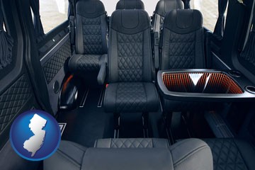 black leather seats in a customized van - with New Jersey icon