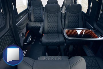black leather seats in a customized van - with New Mexico icon