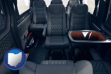 black leather seats in a customized van - with Ohio icon