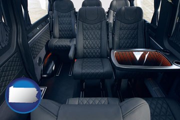 black leather seats in a customized van - with Pennsylvania icon