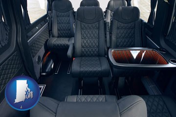 black leather seats in a customized van - with Rhode Island icon