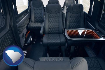black leather seats in a customized van - with South Carolina icon