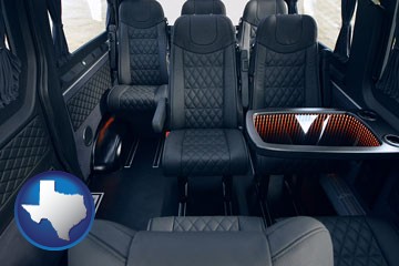 black leather seats in a customized van - with Texas icon