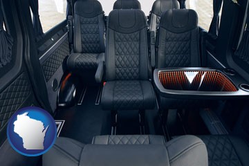 black leather seats in a customized van - with Wisconsin icon